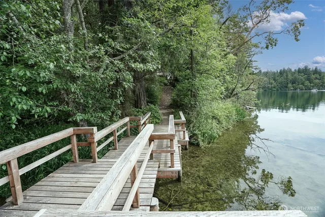a backyard of a house with barbeque oven table and chairs