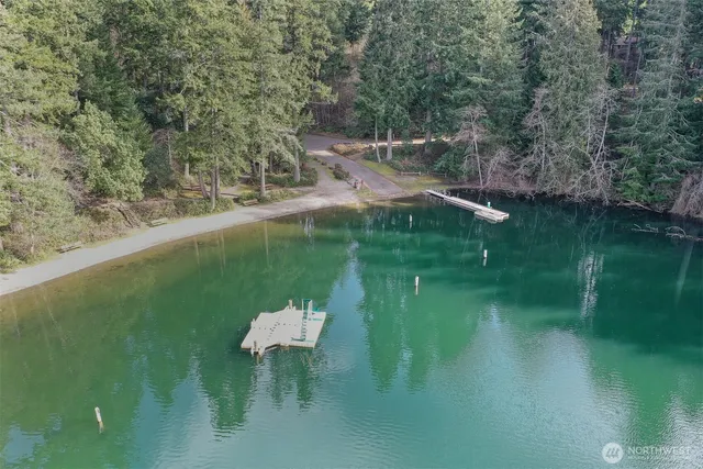 a view of sign board with a small yard