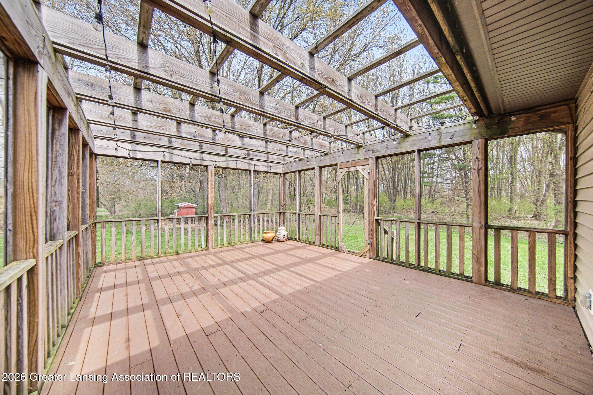 2898 North Every Road Mason, MI 48854 - Photo 15 of 44 sunporch adjacent great room