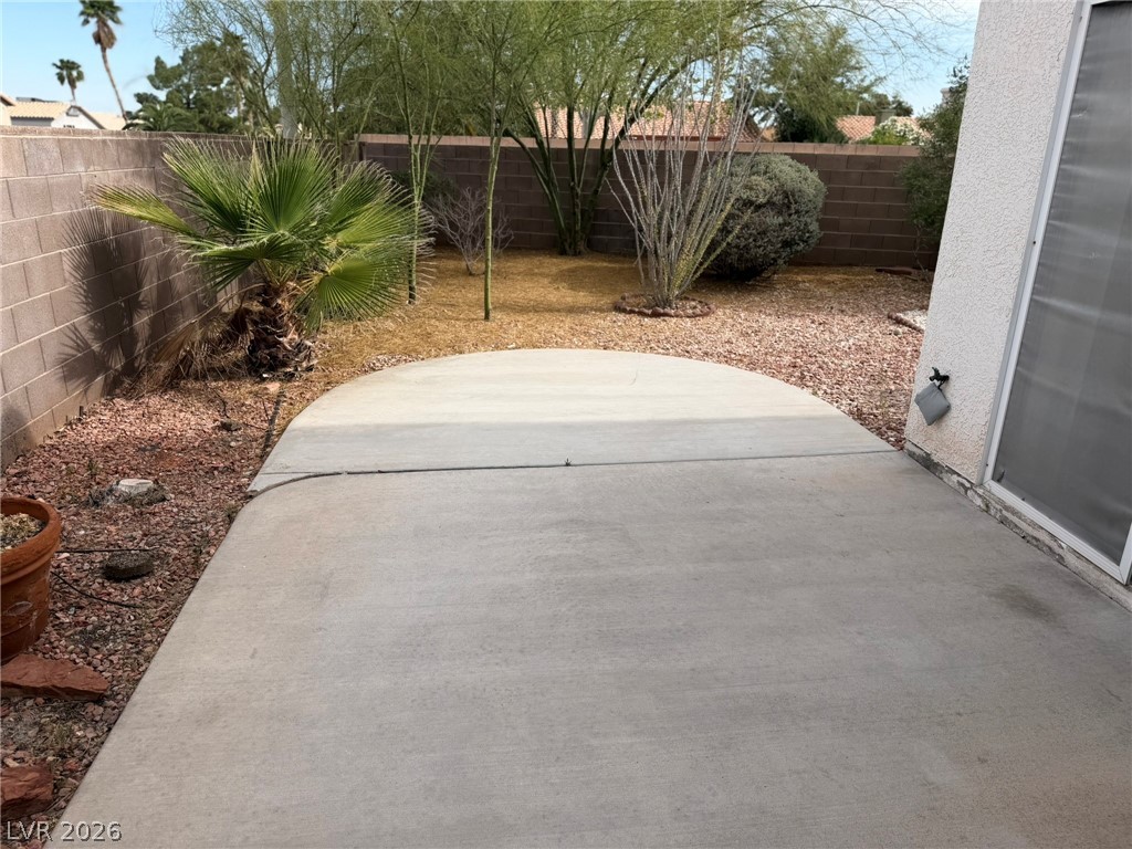 277 Gentle Bay Avenue Henderson, NV 89074 - Photo 14 of 43 This spacious patio offers an ideal setting for relaxation and outdoor enjoyment.