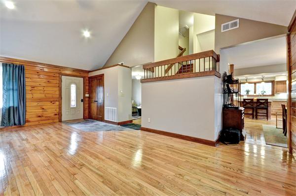 119 Pecunit Street Canton, MA 02021 - Photo 12 of 28 a view of a livingroom with wooden floor and stairs