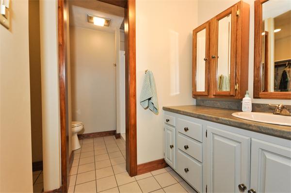 119 Pecunit Street Canton, MA 02021 - Photo 22 of 28 a bathroom with a granite countertop sink and a mirror