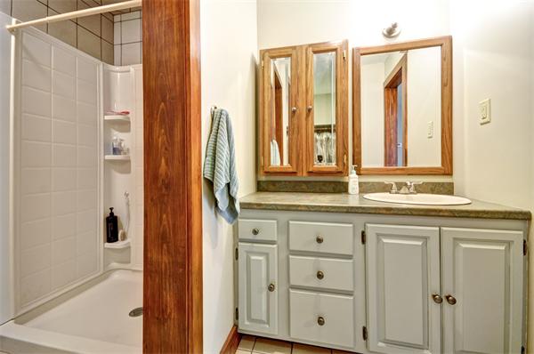 119 Pecunit Street Canton, MA 02021 - Photo 23 of 28 a bathroom with a granite countertop sink and a mirror