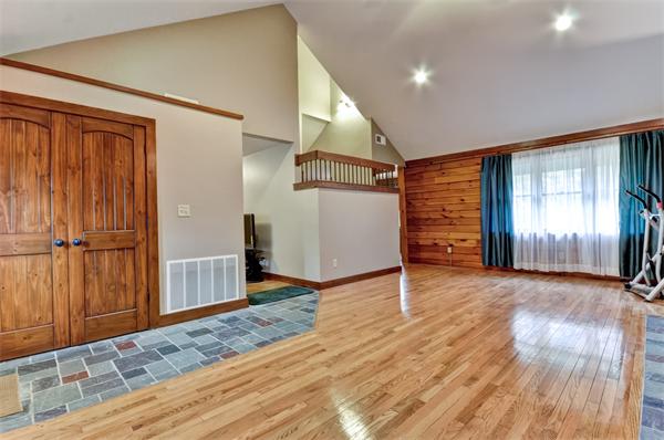 119 Pecunit Street Canton, MA 02021 - Photo 9 of 28 a view of a livingroom with wooden floor and stairs