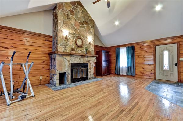 119 Pecunit Street Canton, MA 02021 - Photo 10 of 28 a view of a livingroom with wooden floor and a fireplace