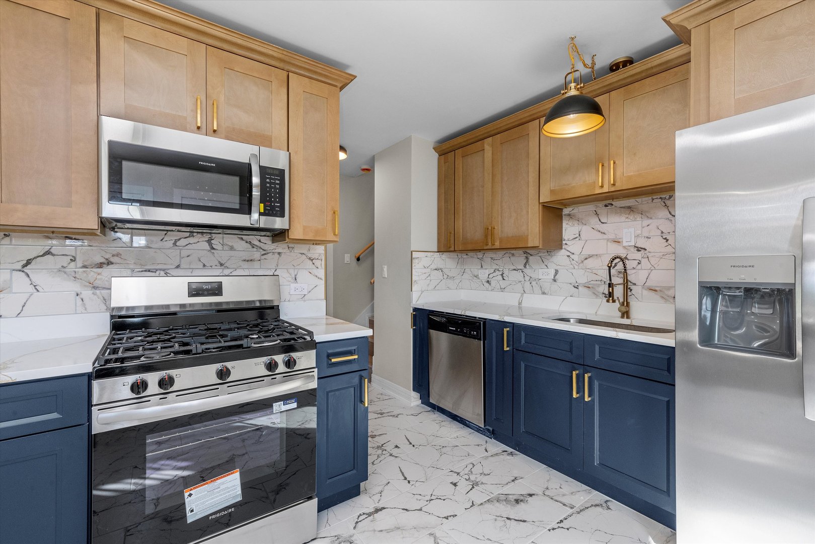 16619 Marshfield Avenue Markham, IL 60428 - Photo 11 of 41 a kitchen with stainless steel appliances a stove a sink and a microwave