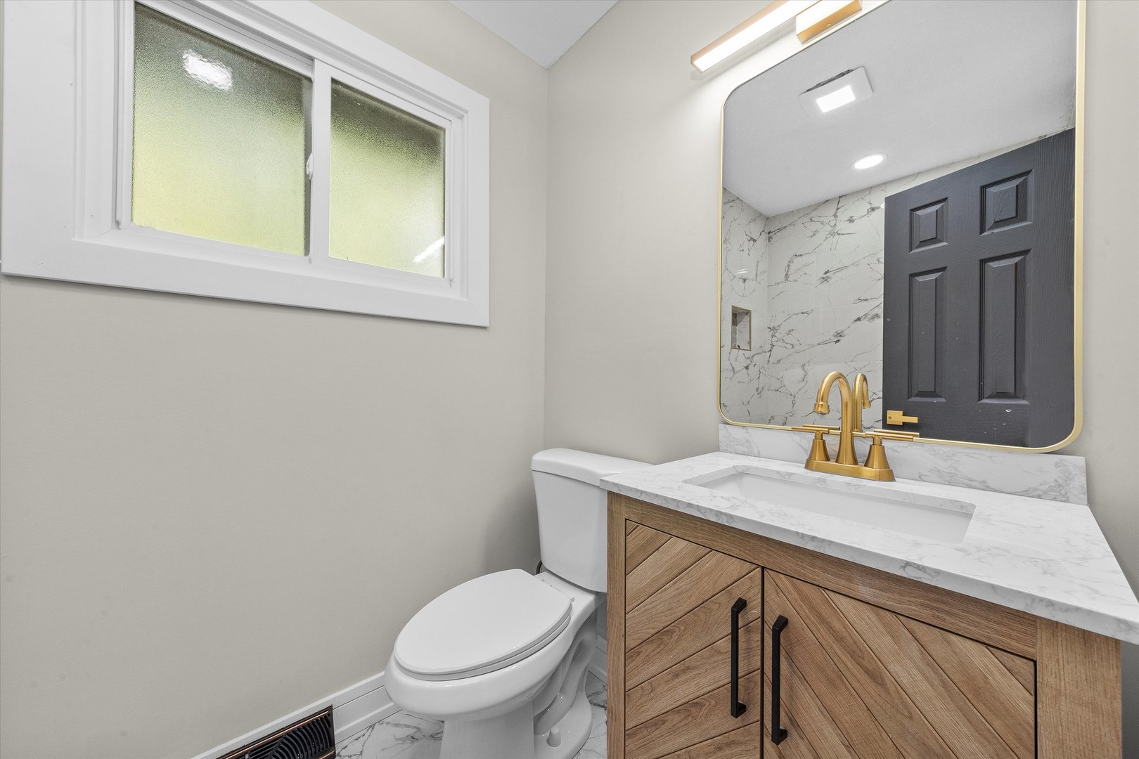 16619 Marshfield Avenue Markham, IL 60428 - Photo 14 of 41 a bathroom with a sink toilet and mirror