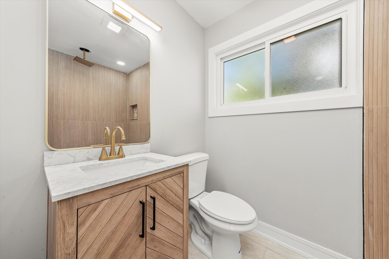 16619 Marshfield Avenue Markham, IL 60428 - Photo 20 of 41 a bathroom with a sink a toilet and mirror