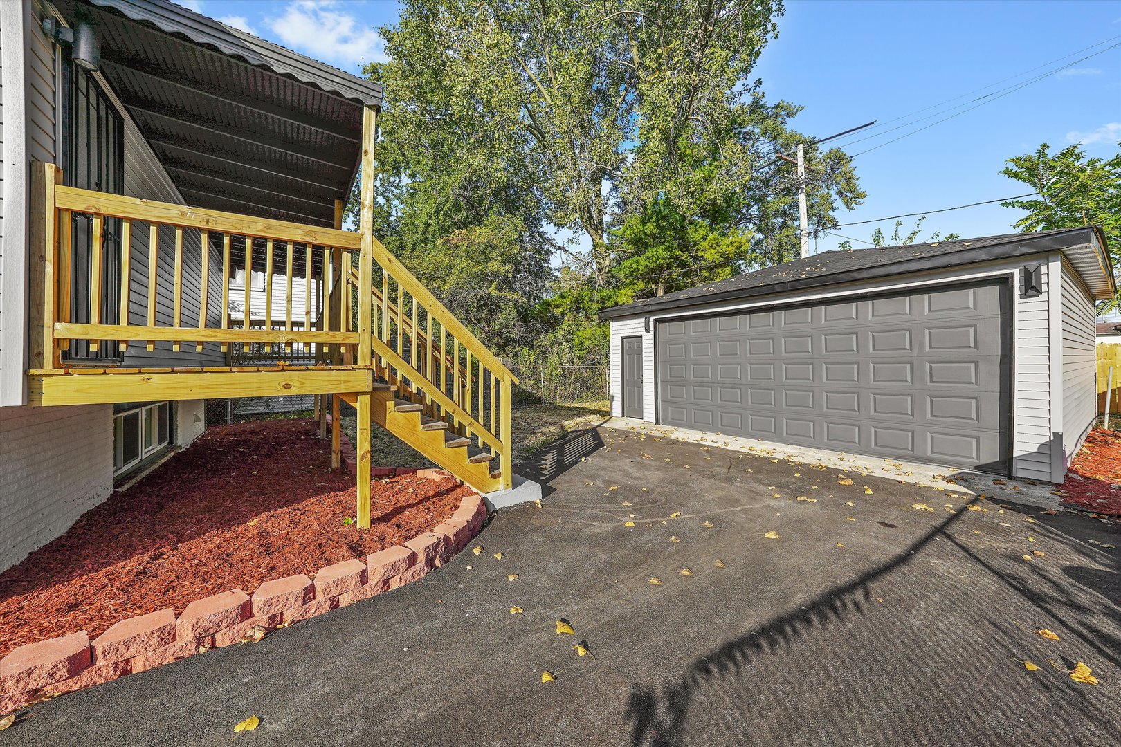 16619 Marshfield Avenue Markham, IL 60428 - Photo 35 of 41 a view of backyard with deck and seating area