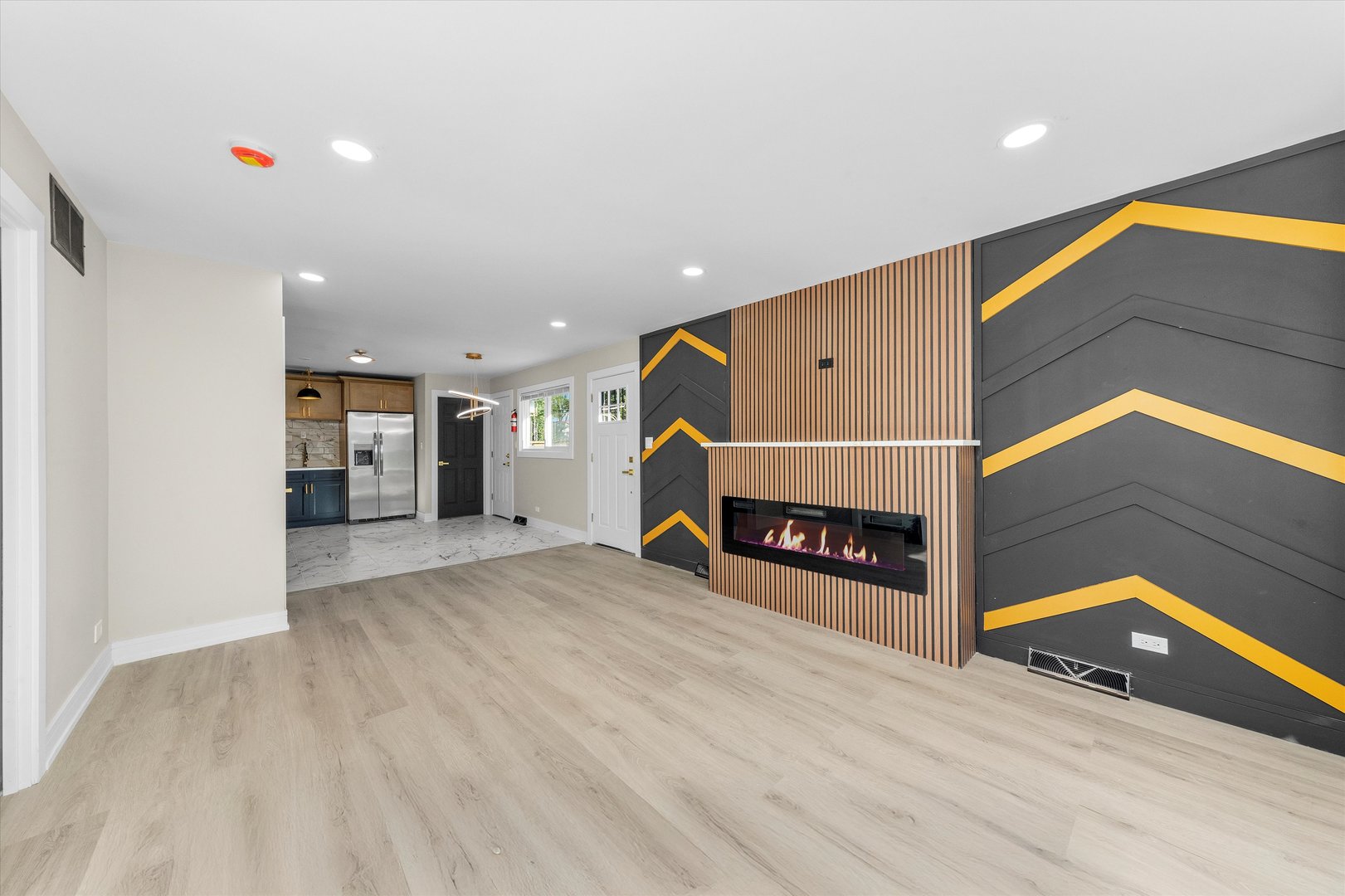 16619 Marshfield Avenue Markham, IL 60428 - Photo 4 of 41 a view of a big room with wooden floor and staircase