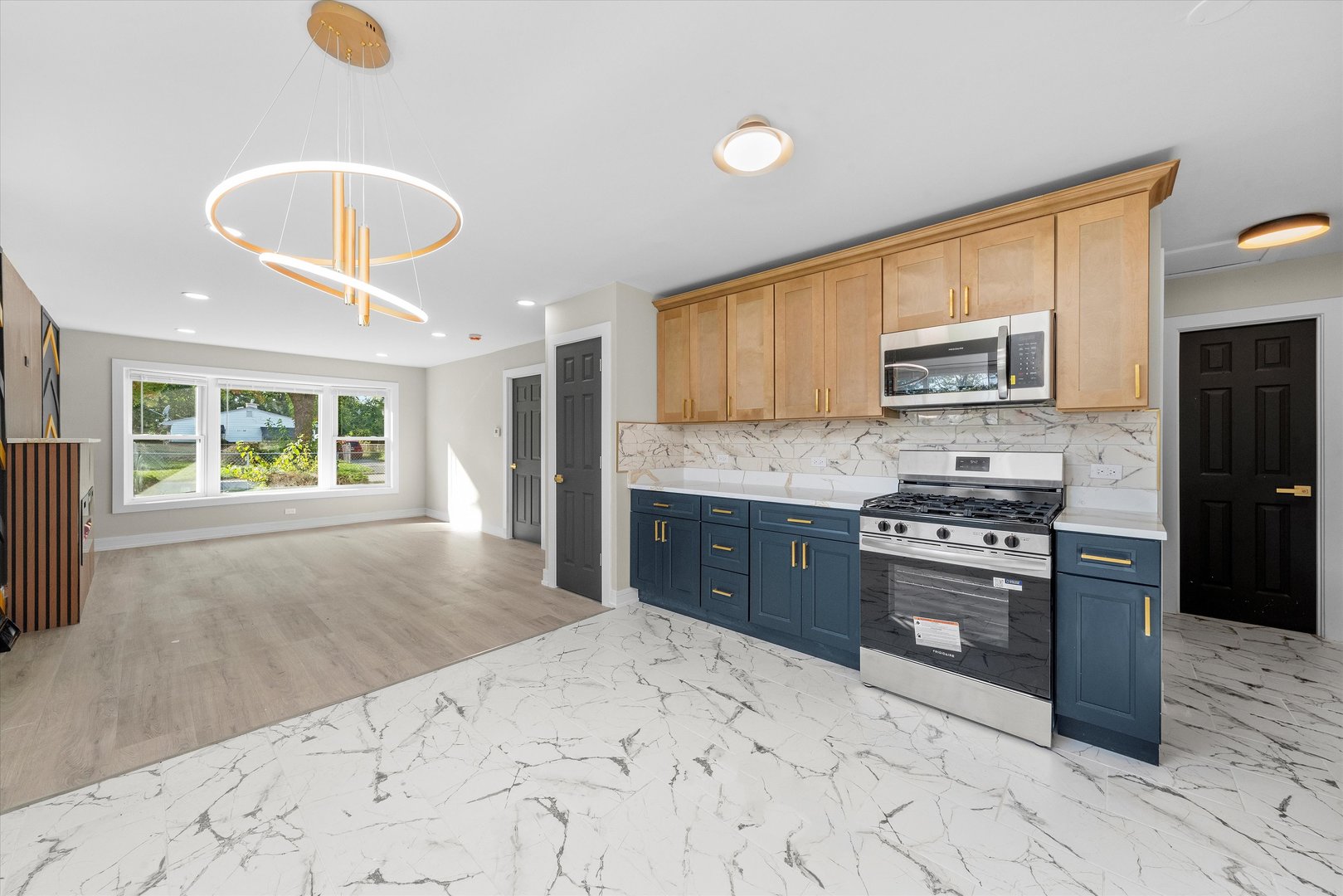 16619 Marshfield Avenue Markham, IL 60428 - Photo 8 of 41 a kitchen with stainless steel appliances granite countertop a stove refrigerator and a sink