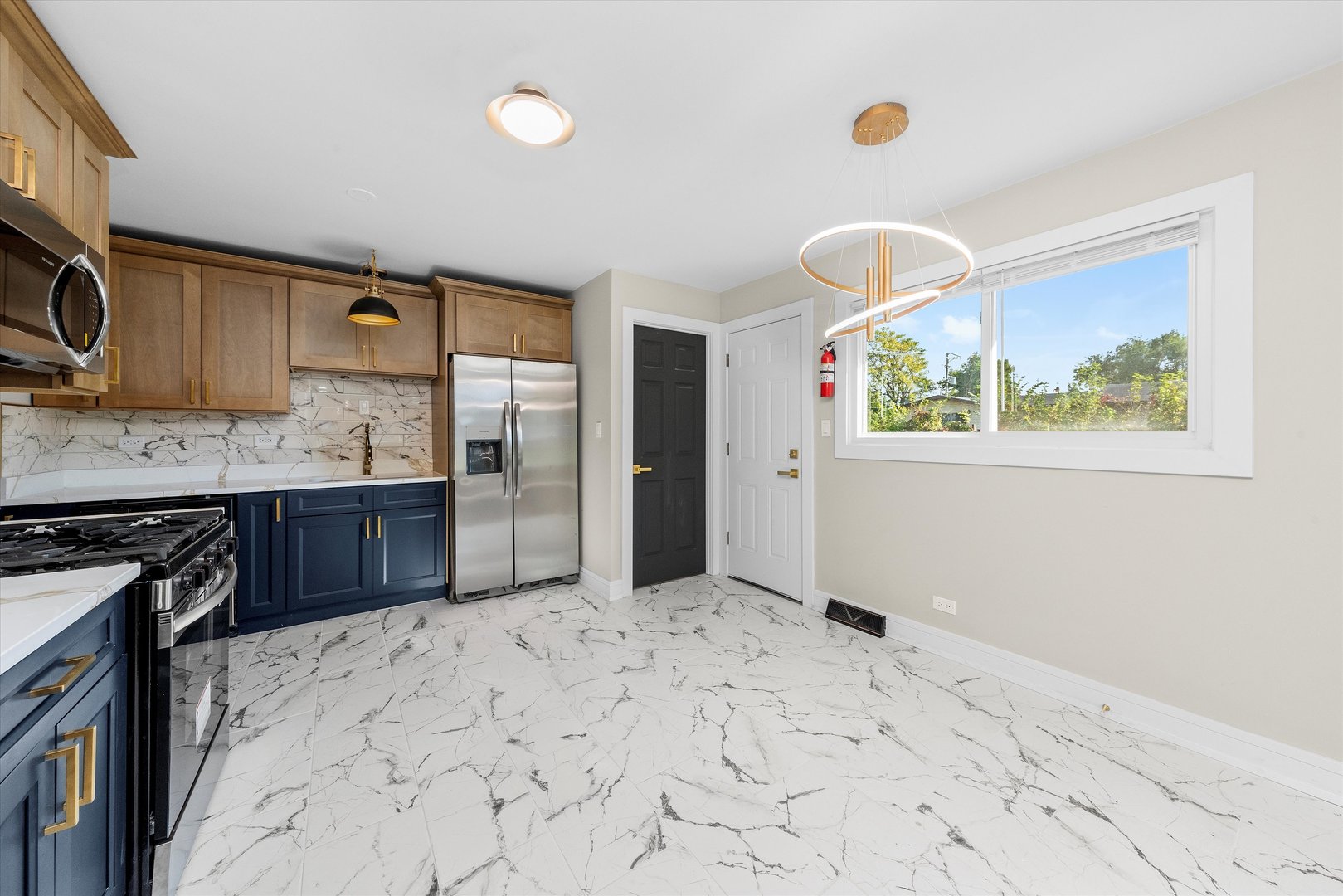 16619 Marshfield Avenue Markham, IL 60428 - Photo 10 of 41 a kitchen with stainless steel appliances granite countertop a stove a sink and a refrigerator