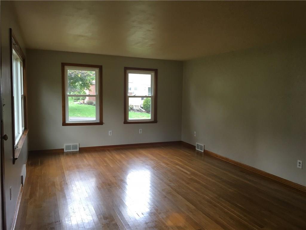 1110 Tuscarawas Road Beaver, PA 15009 - Photo 10 of 24 Hardwood flooring in spacious living room.
