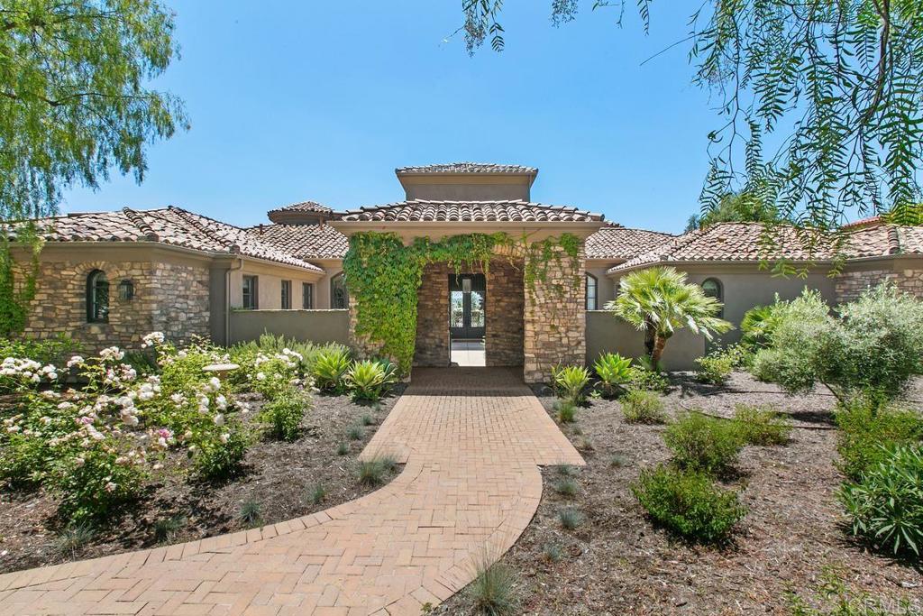18365 Old Coach Way Poway, CA 92064 - Photo 2 of 55 a front view of a house with garden