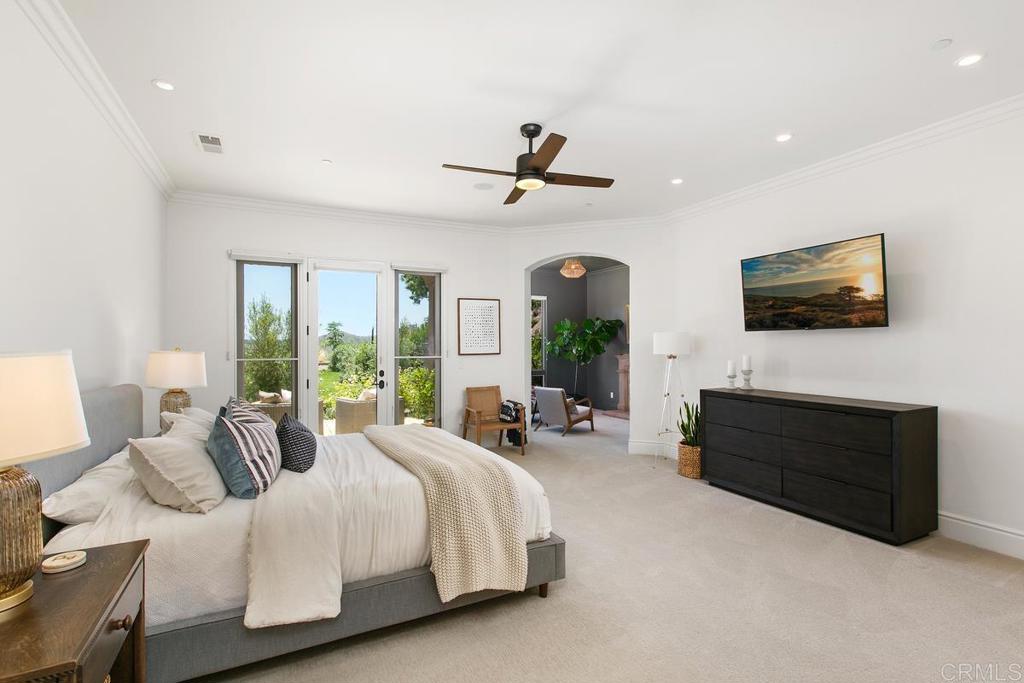 18365 Old Coach Way Poway, CA 92064 - Photo 23 of 55 a spacious bedroom with a bed and glass wall