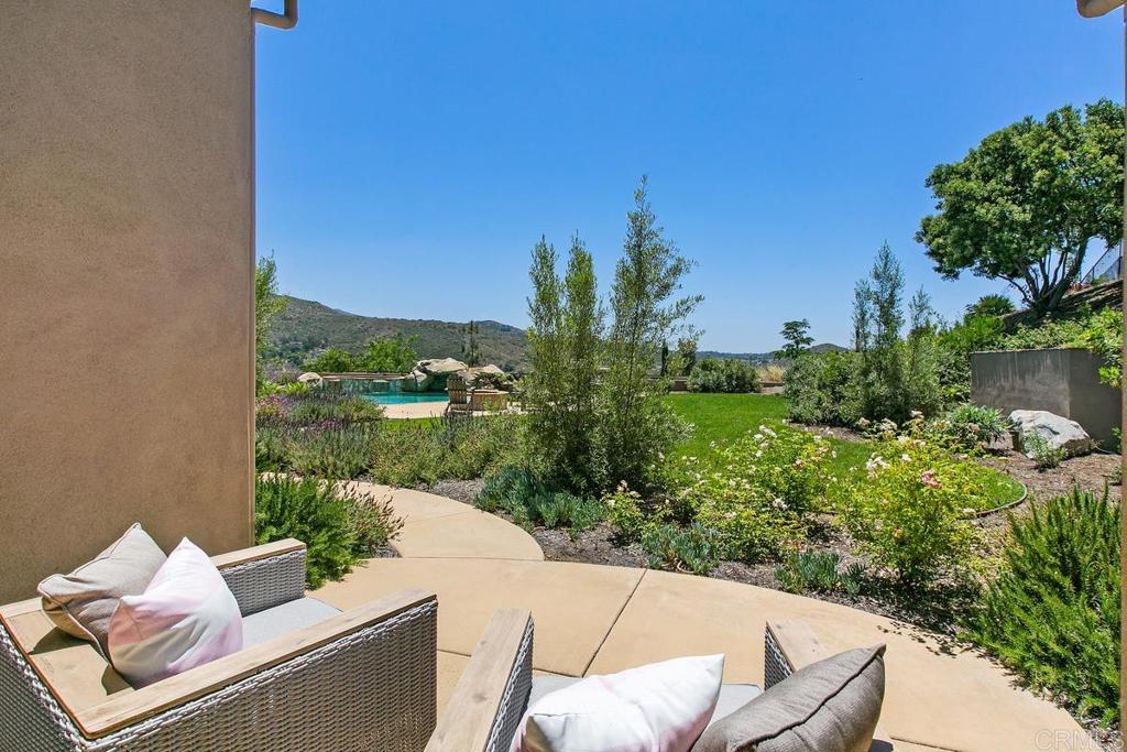 18365 Old Coach Way Poway, CA 92064 - Photo 25 of 55 a view of a patio with couches and potted plants