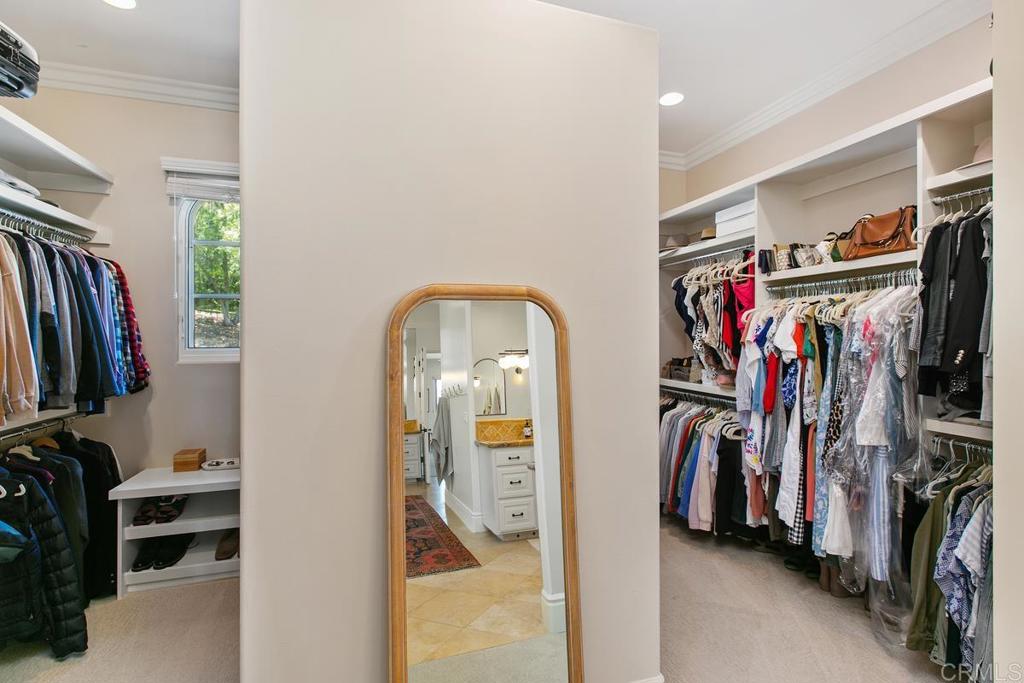 18365 Old Coach Way Poway, CA 92064 - Photo 29 of 55 a view of walk in closet with clothes