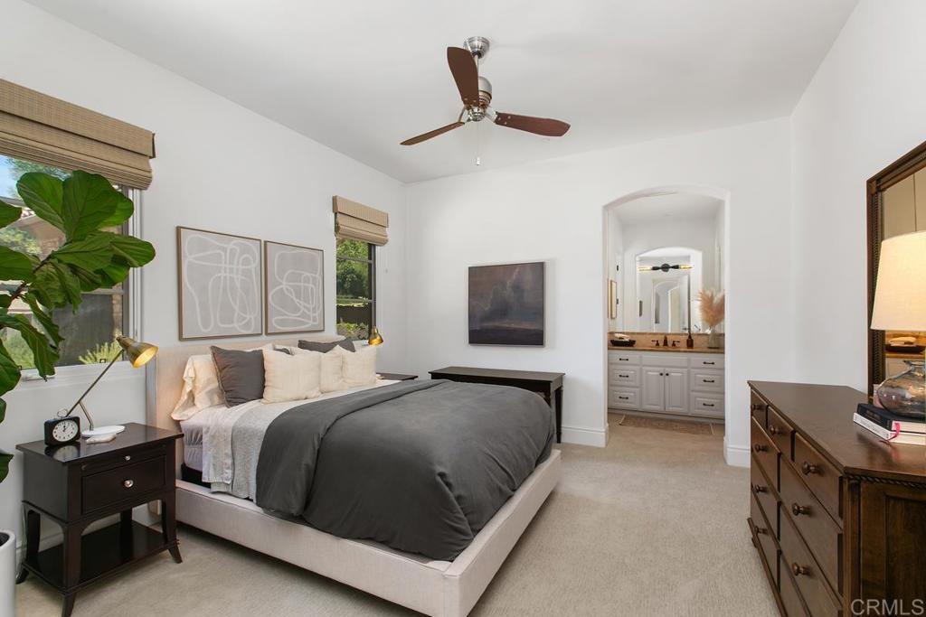 18365 Old Coach Way Poway, CA 92064 - Photo 35 of 55 a bedroom with a bed a couch and a flat tv screen