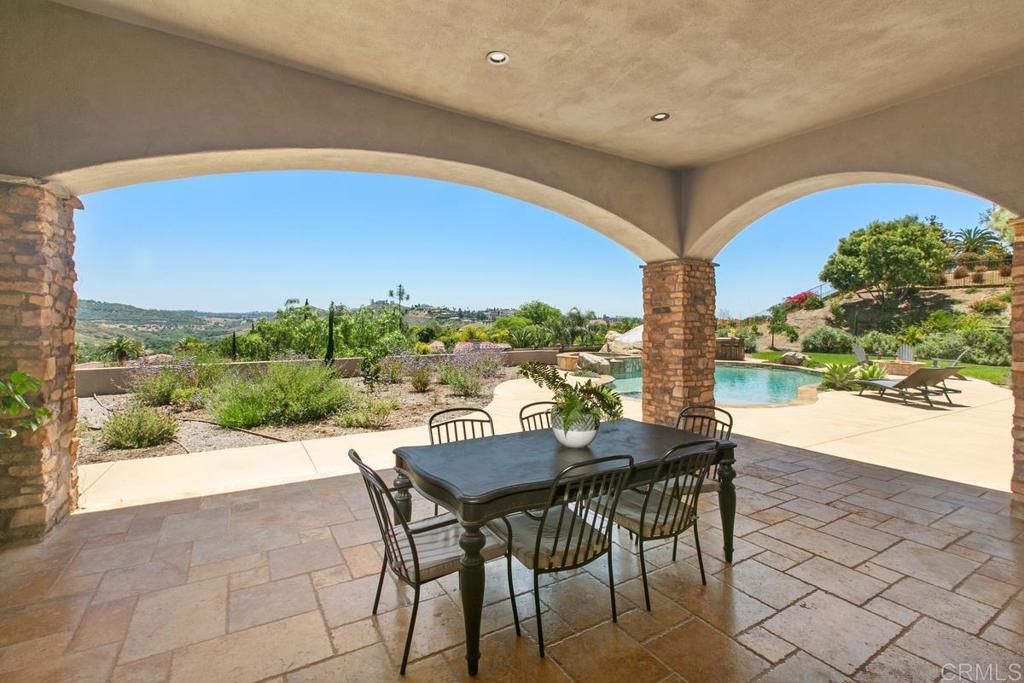 18365 Old Coach Way Poway, CA 92064 - Photo 38 of 55 a view of an outdoor dining space with furniture and city view