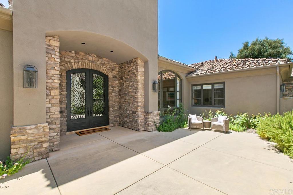 18365 Old Coach Way Poway, CA 92064 - Photo 4 of 55 a front view of a house with garden