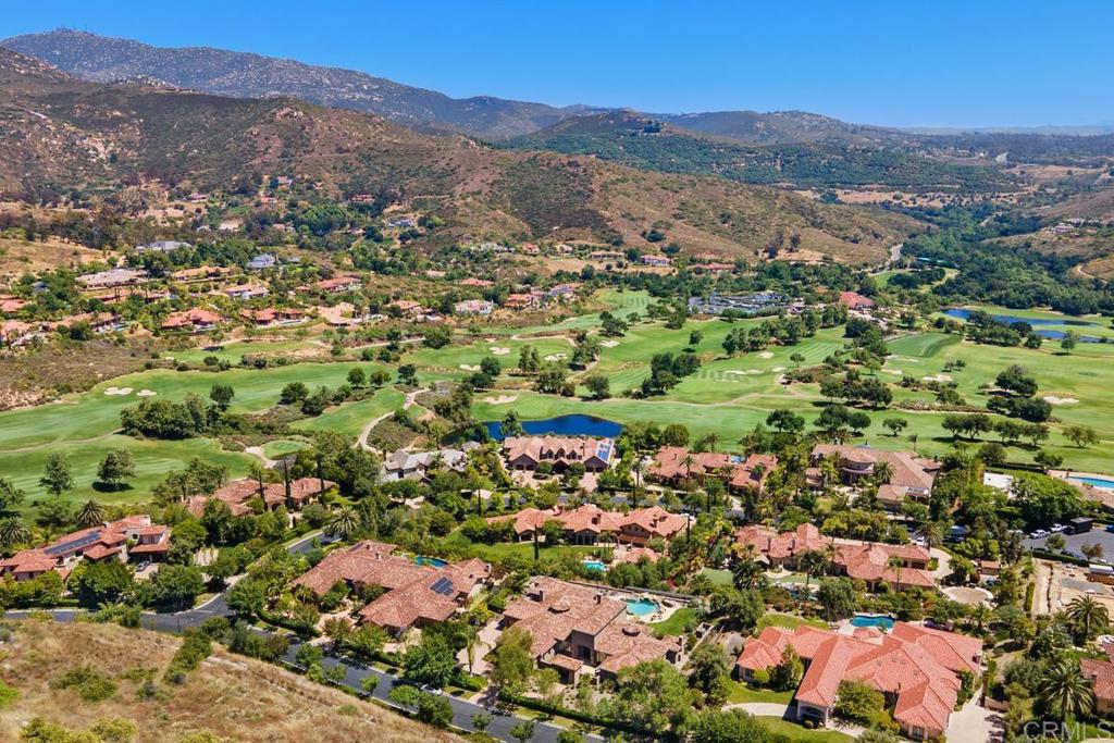18365 Old Coach Way Poway, CA 92064 - Photo 53 of 55 an aerial view of a houses with a lush green hillside