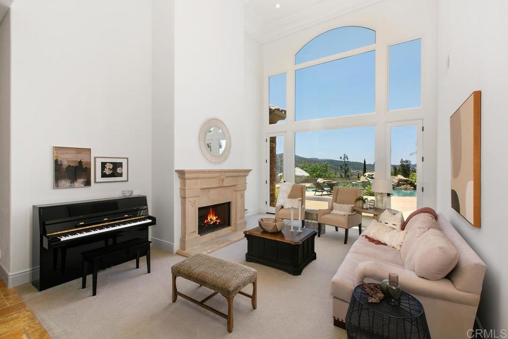 18365 Old Coach Way Poway, CA 92064 - Photo 6 of 55 a living room with furniture fireplace and a piano