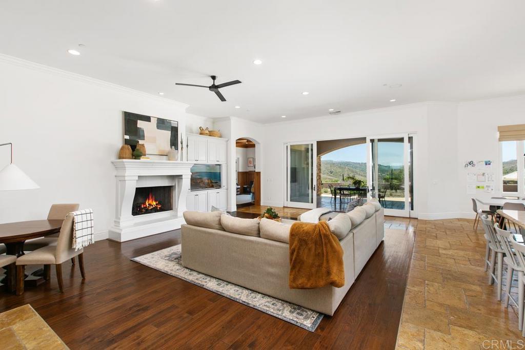 18365 Old Coach Way Poway, CA 92064 - Photo 9 of 55 a living room with furniture large window and a fireplace