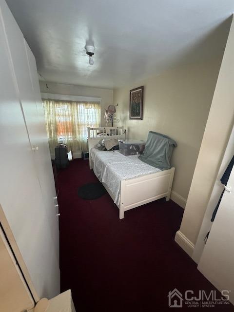 190 Lewis Street Perth Amboy, NJ 08861 - Photo 12 of 17 a spacious bedroom with a bed and wooden floor