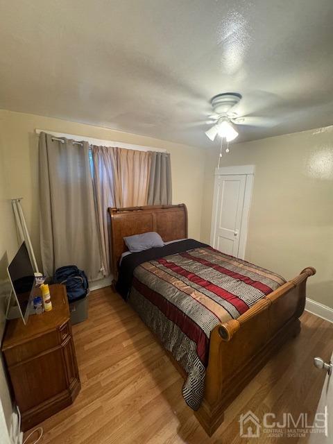 190 Lewis Street Perth Amboy, NJ 08861 - Photo 15 of 17 a bed sitting in a bedroom next to a window