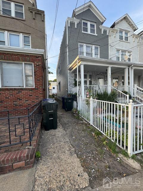 190 Lewis Street Perth Amboy, NJ 08861 - Photo 2 of 17 a front view of a house with a porch