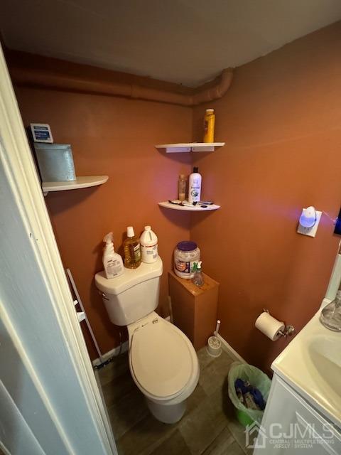 190 Lewis Street Perth Amboy, NJ 08861 - Photo 6 of 17 a bathroom with a toilet and a sink