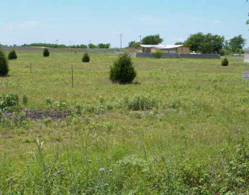 11551 Maha Loop Road Austin, TX 78719 - Photo 1 of 1 a view of a lake with houses