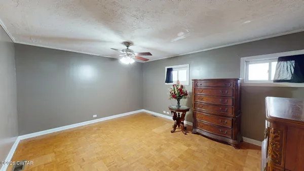 a view of room with window and ceiling fan