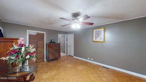 a living room with furniture and flowers