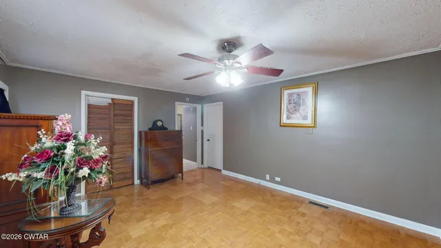 a living room with furniture and flowers