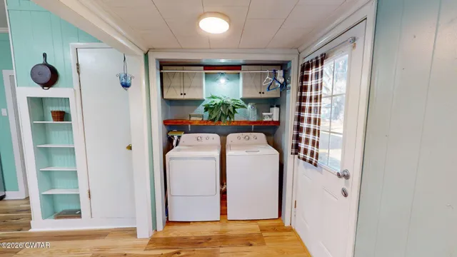 a view of entryway with bathroom and front door