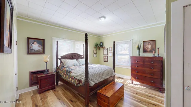 a bedroom with a bed and a dresser