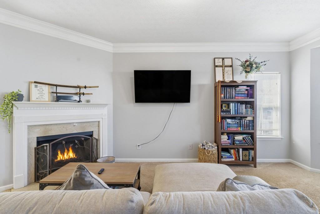 100 Benfield Circle Southeast Cartersville, GA 30121 - Photo 11 of 24 a living room with a flat screen tv and a fireplace