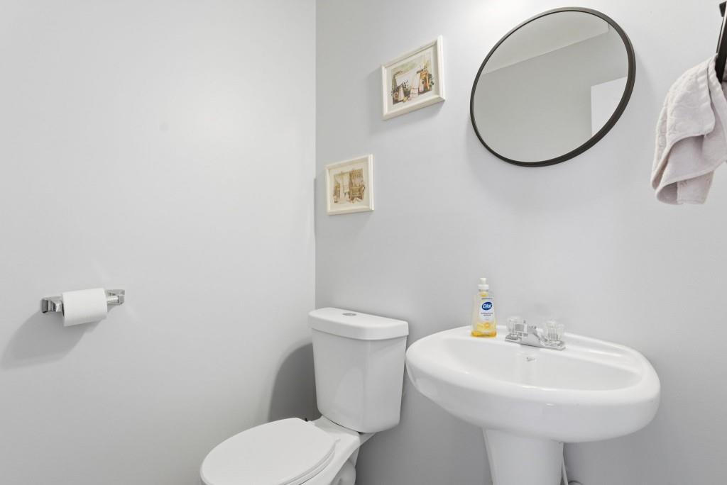 100 Benfield Circle Southeast Cartersville, GA 30121 - Photo 12 of 24 a bathroom with a toilet a sink and a mirror