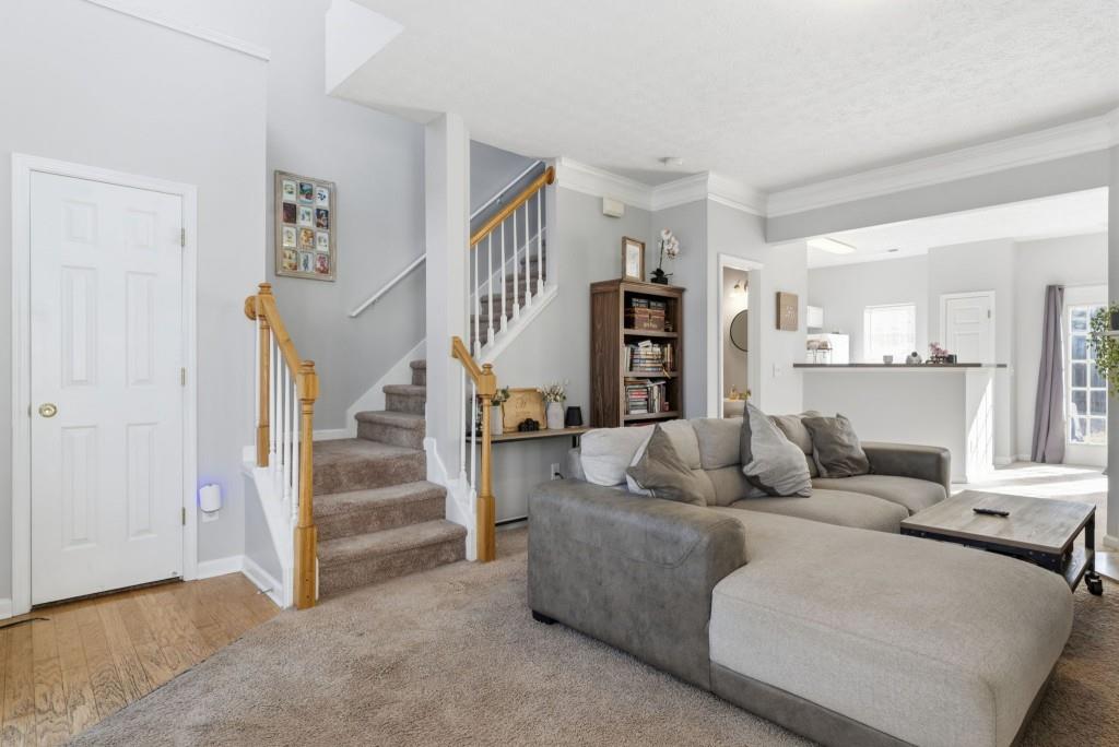 100 Benfield Circle Southeast Cartersville, GA 30121 - Photo 16 of 24 a living room with furniture and a wooden floor