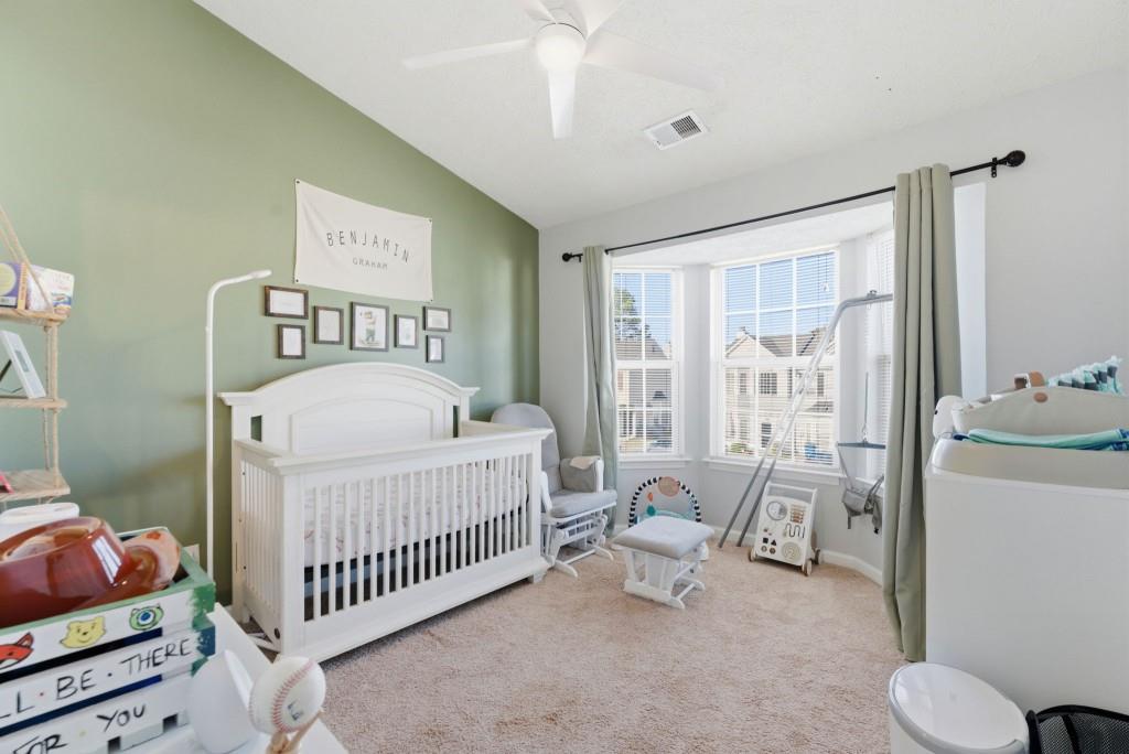 100 Benfield Circle Southeast Cartersville, GA 30121 - Photo 17 of 24 a bedroom with a bed and a window