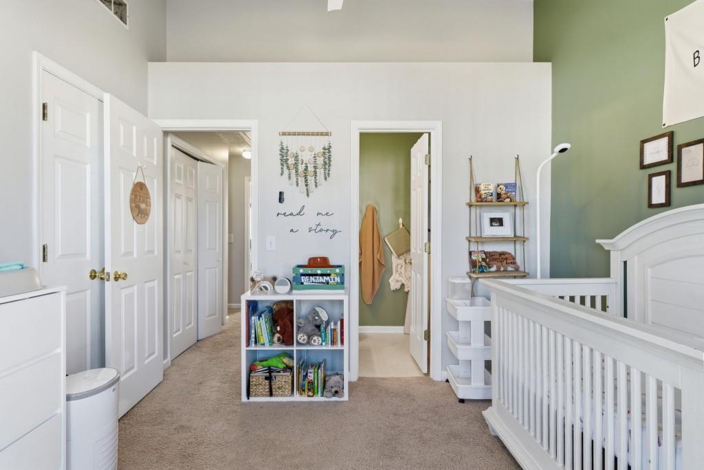 100 Benfield Circle Southeast Cartersville, GA 30121 - Photo 19 of 24 a view of a bedroom with baby crib and furniture