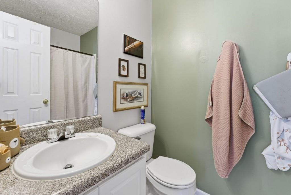 100 Benfield Circle Southeast Cartersville, GA 30121 - Photo 20 of 24 a bathroom with a granite countertop sink and a mirror