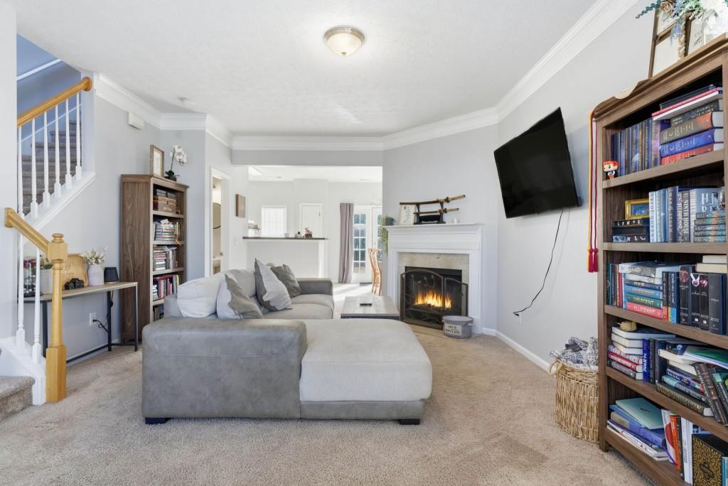 100 Benfield Circle Southeast Cartersville, GA 30121 - Photo 9 of 24 a living room with fireplace furniture and a flat screen tv