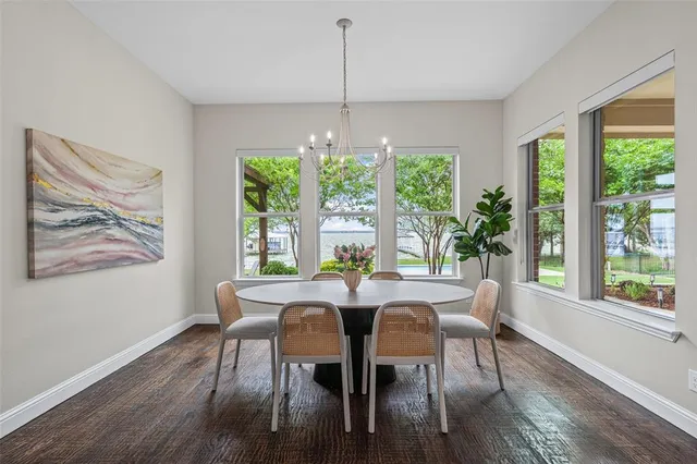 a large kitchen with a large counter top appliances and cabinets