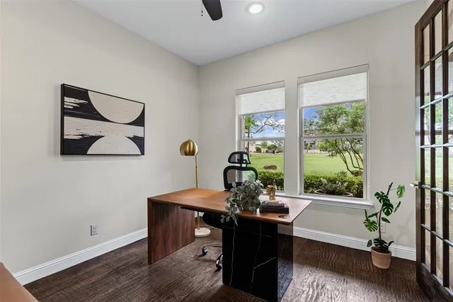 a bedroom with a large bed and a large window