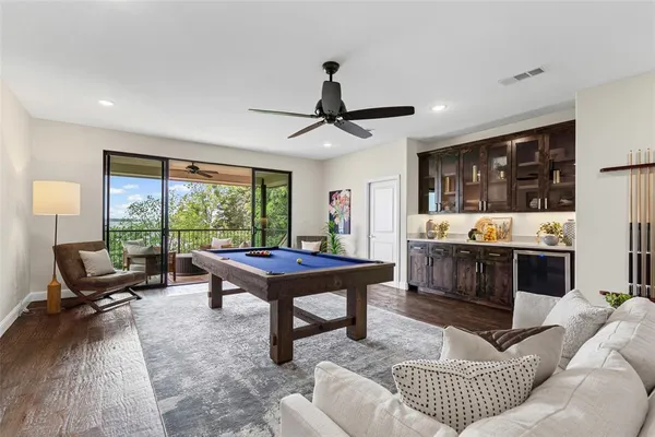 a view of a deck with couches and wooden floor