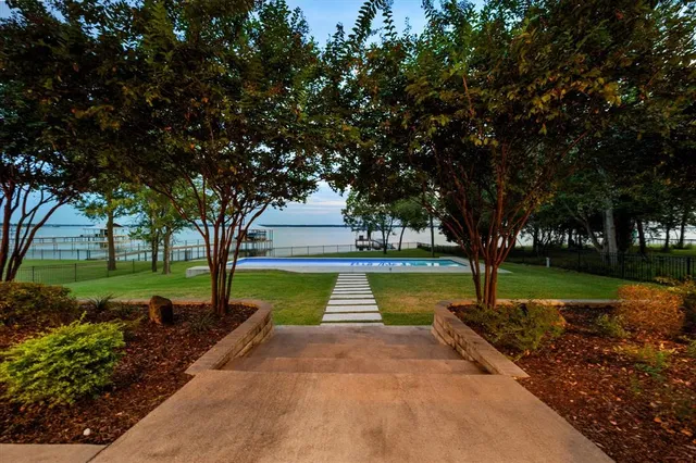 a view of a swimming pool and a yard