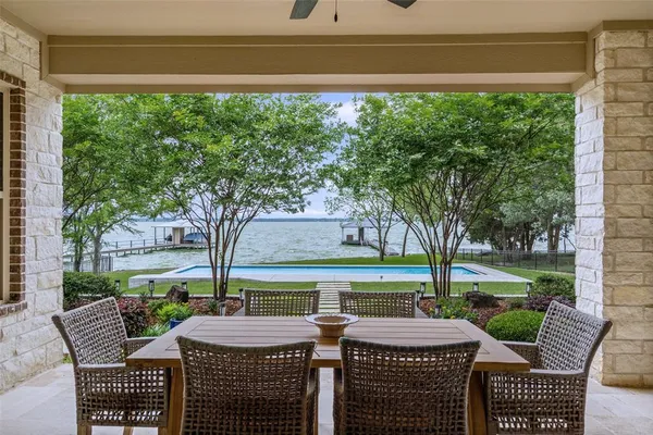 a view of a patio with furniture and a yard