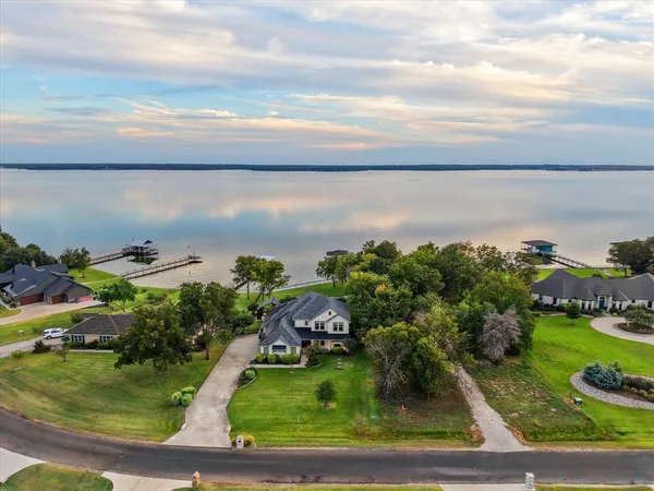 a view of a lake with a yard